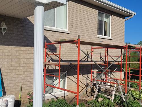 Picture 10 of Donovan Masonry craftsmen working on window sills